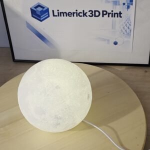3D printed Moon Lamp switched on, glowing softly and showing its lunar surface